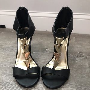 Black and gold heels